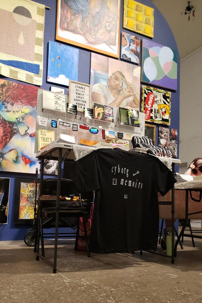 My table setup with dramatic gallery wall backdrop at the BIG SUMMER BOOK SALE at Icebox Project Space.