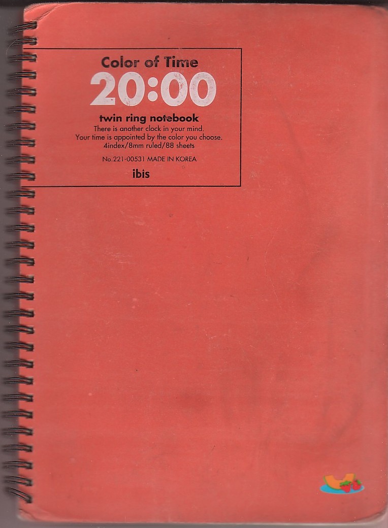 red notebook with black spiral ring