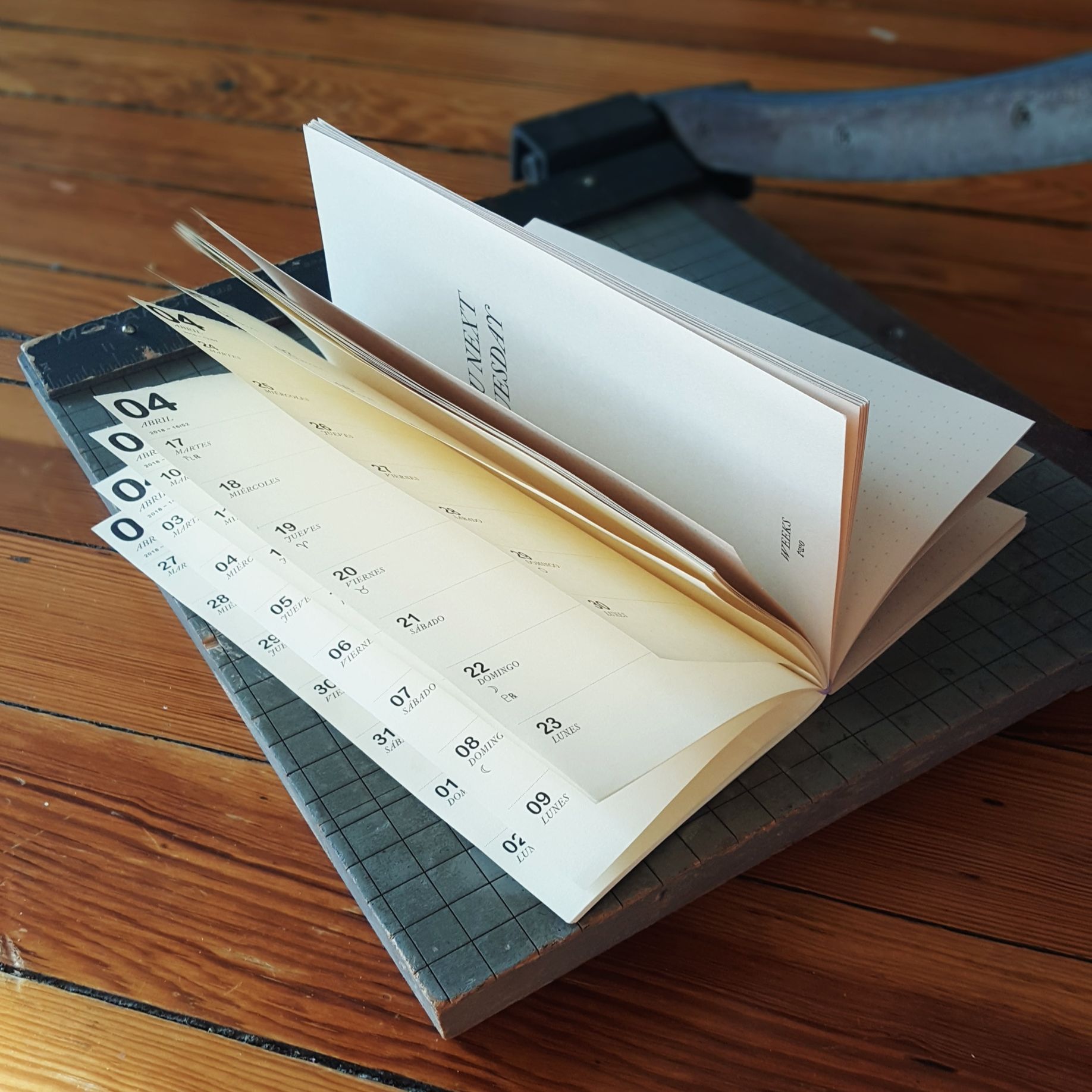 planner laying open on top of paper cutter