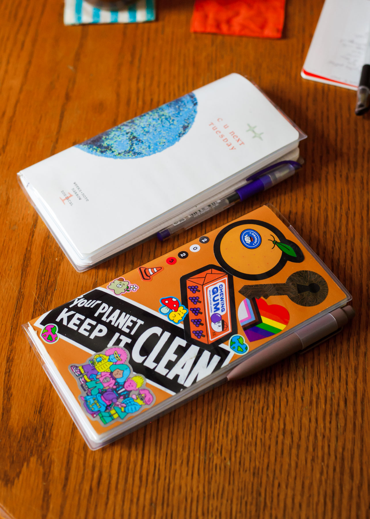 notebooks in clear covers on table