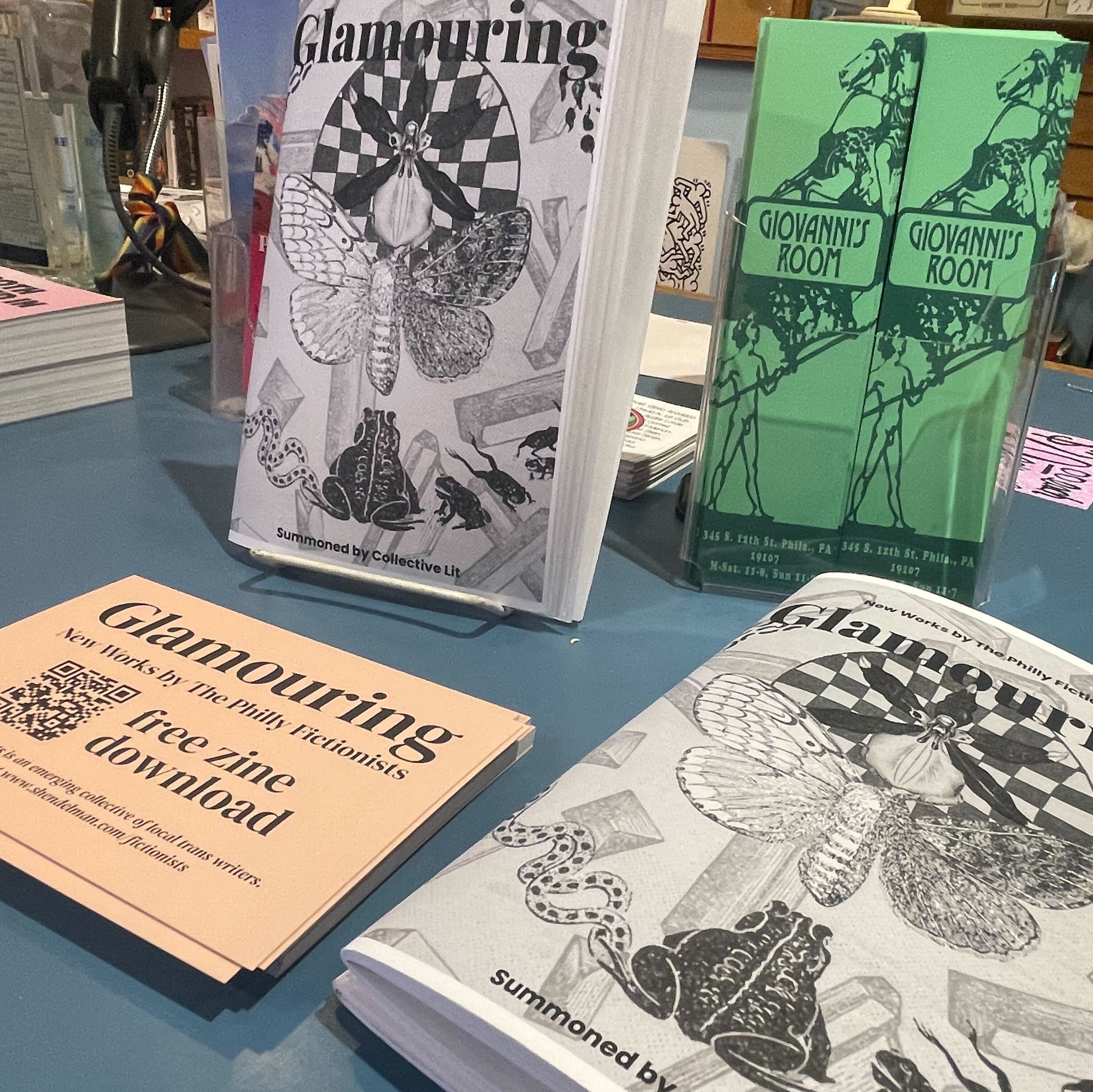 zines and postcards on table